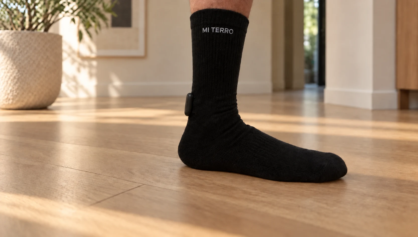 Mi Terro sock worn in a home setting, with pressure and temperature tracking highlights and a heel-to-toe gait trace