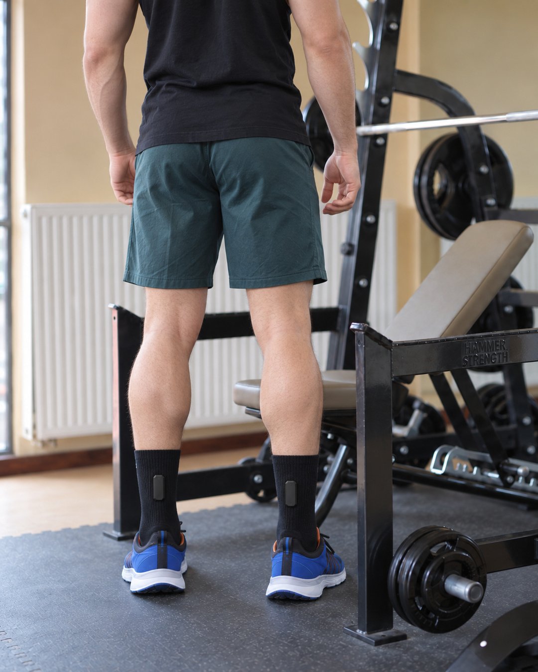 Black Mi Terro socks at the gym with sealed modules visible behind both ankles