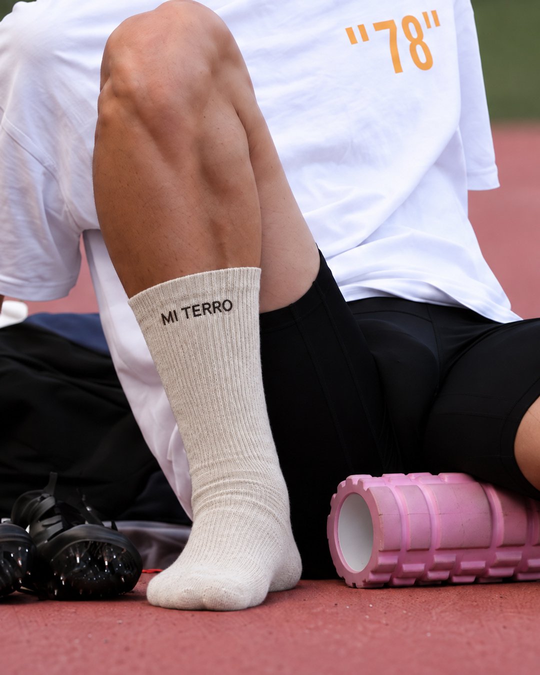 Athlete resting after training in cream Mi Terro socks